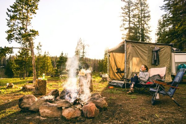 a-woman-relaxing-at-a-camp