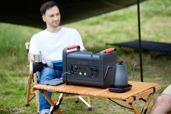 a-man-who-uses-a-portable-power-source-outdoors