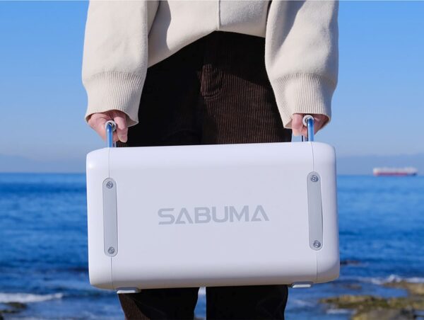 woman-holding-a-portable-power-supply-in-both-hands