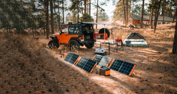 A-portable-power-source-and-solar-panel-are-used-at-the-campsite.