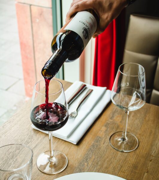 a-man-who-pours-red-wine